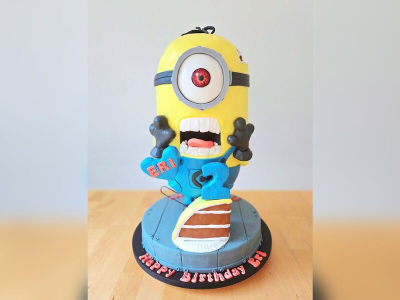 Custom sculpted cake — Minion cake