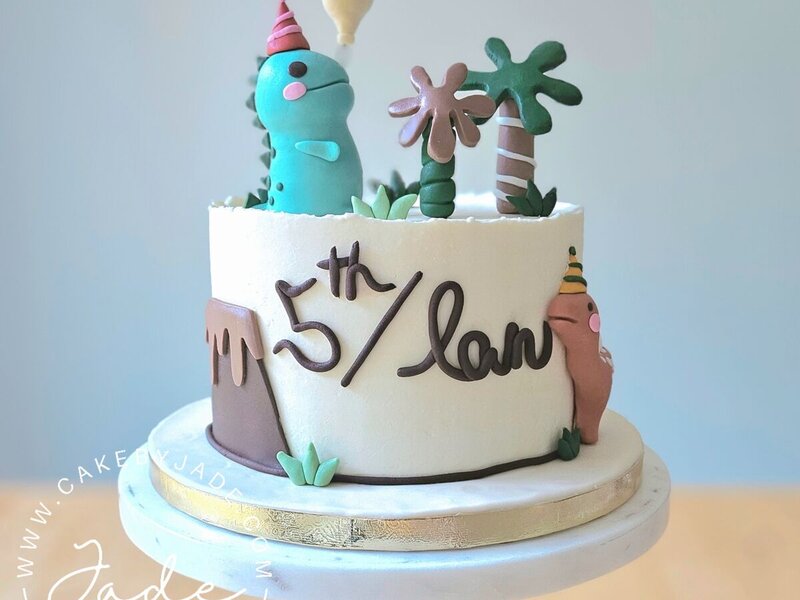 Round cake — dinosaur birthday cake